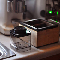 0.6L Ankomn Turn-N-Seal vacuum storage canister next to knockbox